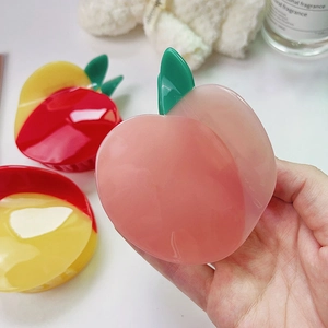 Pink peach and mango acetate fruit hair claws set in a aesthetic lifestyle scene