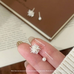 Macro detail of dandelion snowflake earring and pearl with measurement dimensions