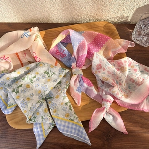Floral cotton linen head scarves in vintage pastoral style displayed on a wooden tray