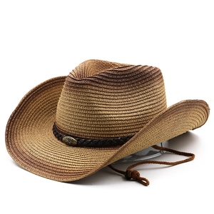 Detailed weave of straw cowboy hat featuring a leather band and metal bull emblem