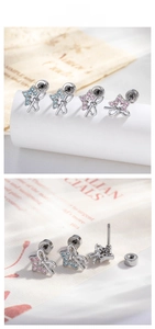 Detailed close-up of bow and star ear studs with zircon in pink and blue colors