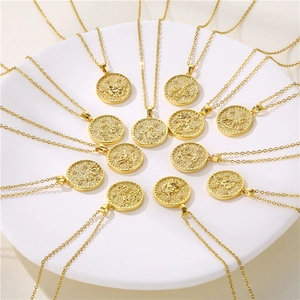 Gold circular birth flower necklaces with embossed floral motifs and zircon accents