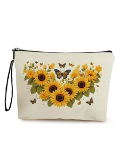 Detail showing sunflower and butterfly print on a beige canvas cosmetic bag with zipper
