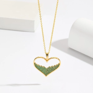 18K gold plated necklace featuring a hollow heart pendant with emerald green micro-inlays