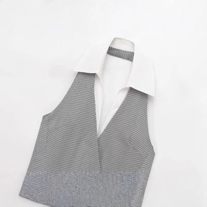 Halter neck mini dress featuring grey houndstooth pattern and contrast white lapel