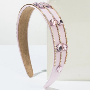 Detail of pink baroque headband with rows of crystals and drop-shaped faux gems