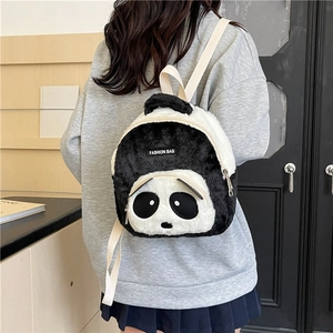 Close-up of cute panda plush backpack with white strap and black FASHION BAG label