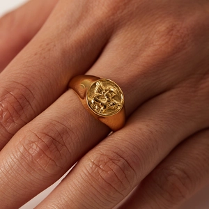 18k gold plated stainless steel signet ring featuring a detailed embossed angel design
