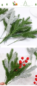 Macro shot of artificial pine needles and red berries for Christmas floral DIY decoration
