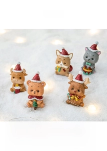 Detailed view of 5 cute Christmas animal figurines with Santa hats on artificial snow