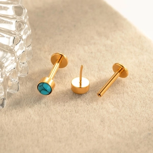 Gold titanium flat back labret stud featuring a vibrant blue turquoise gemstone inlay