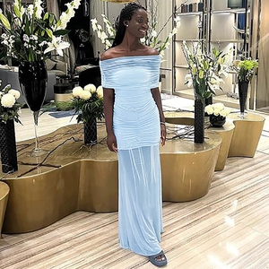 Detail view of the light blue ruched mesh fabric on a stylish off-shoulder summer maxi dress