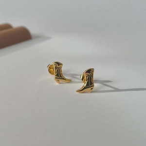 Golden cowboy boot earrings with a polished 18k gold plated finish for a vintage look