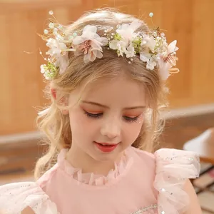Elegant floral crown for girls featuring pink silk flowers and delicate pearl accents