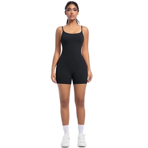Close-up of black bodycon athletic romper with slim straps and matte high-stretch fabric