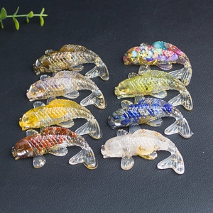 Top view of eight resin koi fish figurines with gold foil and crystal stone fillings