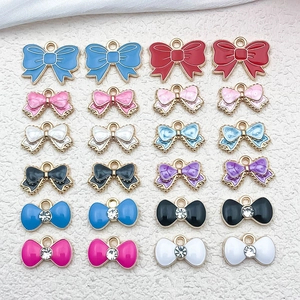 Colorful enamel bow charms with rhinestones for DIY jewelry making in various vibrant shades