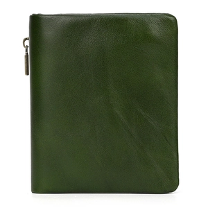 Close-up of green genuine leather wallet showing natural grain and vintage bronze zipper