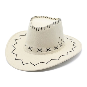 Detail of cream western cowboy hat with black decorative stitching and metal eyelets