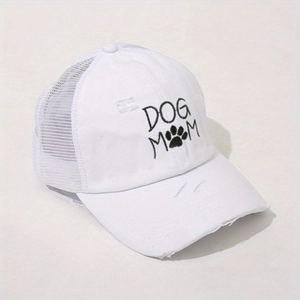 Detailed embroidery of DOG MOM with a paw print on a distressed white mesh ponytail cap