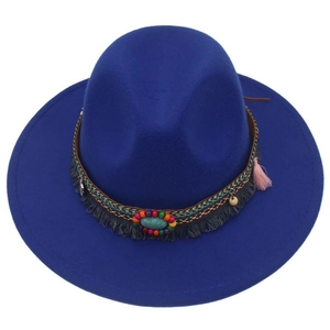 Detail of royal blue felt fedora featuring bohemian beads, turquoise and fringe tassels