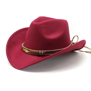 Vintage burgundy western cowboy felt hat with metal feather and woven band