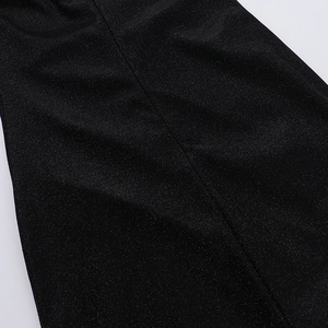 Close-up of black shimmering fabric with fine glitter details for a slim fit dress