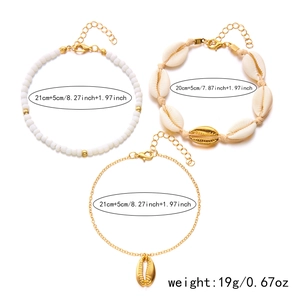 Detailed view of Bohemian gold starfish and shell anklet set with size measurements