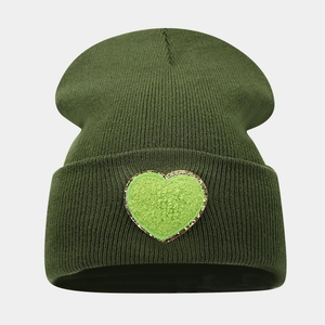 Army green ribbed knit beanie with light green heart patch and gold embroidered border