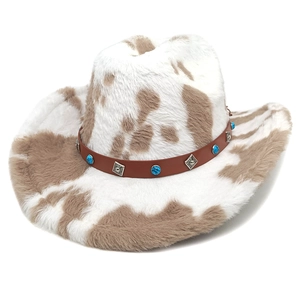 Cow print cowboy hat with turquoise stone and silver accents on a leather band