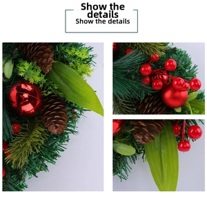 Detail of Christmas wreath featuring red berries, pine cones and green needles