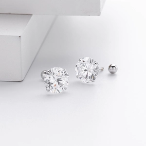 Detailed close-up of S925 sterling silver screw back earrings with four-prong round zircon