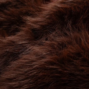Close-up of premium dark brown long-hair faux fur texture showing soft fluffy fibers