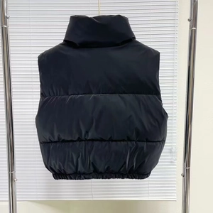Detailed back view of a black padded vest with a stand collar and quilted design