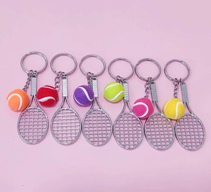 Detailed set of six miniature tennis racket keychains in assorted vibrant colors