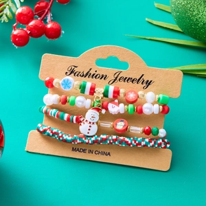 Detail of Christmas beaded bracelet set with Santa Claus and snowflake charms