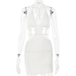 Detailed view of white knit halter dress featuring side cut-outs and lace-up waist details