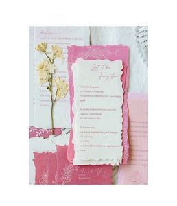 Macro detail of vintage handmade craft paper with dried flowers and wax seal stamps