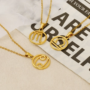 Detailed view of three gold zodiac necklaces featuring Scorpio, Libra and Cancer pendants