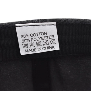 Close-up of the wash care label showing 80% cotton blend fabric and washing symbols