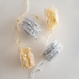 Nastri di Natale champagne e argento con stelle per decorazioni e pacchetti regalo