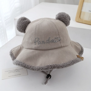 Detailed texture of baby corduroy fisherman hat with plush trim and panda embroidery