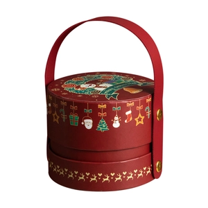 Red cylindrical Christmas gift box with handle and festive snowman illustration