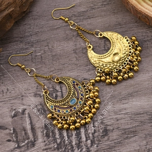 Detailed view of bohemian moon-shaped bell earrings with size measurements 8x4 cm