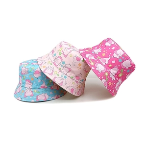 Close-up of cute cartoon elephant patterns on colorful sun hats for kids and babies