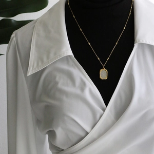 French retro gold titanium steel necklace with rectangular rose relief floral pendant