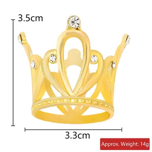 Detailed view of mini golden alloy crown with rhinestones and heart design, 3.5cm high