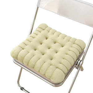 Light green thick biscuit cushion on transparent chair with plush velvet texture
