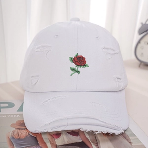 Distressed white cotton baseball cap with red rose embroidery and vintage frayed edges