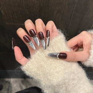 Deep brown and silver cat eye almond press-on nails with sparkling rhinestone accents